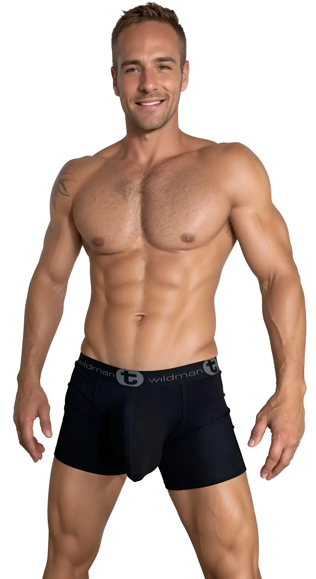 A muscular man wearing black WildmanT boxer briefs with a grey branded waistband, set against a plain white background.