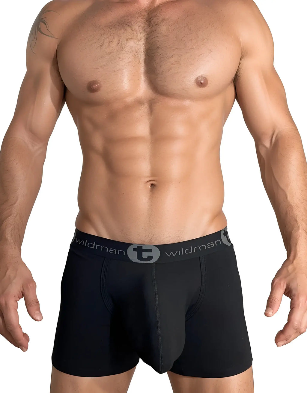 Muscular man wearing black WildmanT boxer briefs with a grey logo waistband and a contoured pouch design.