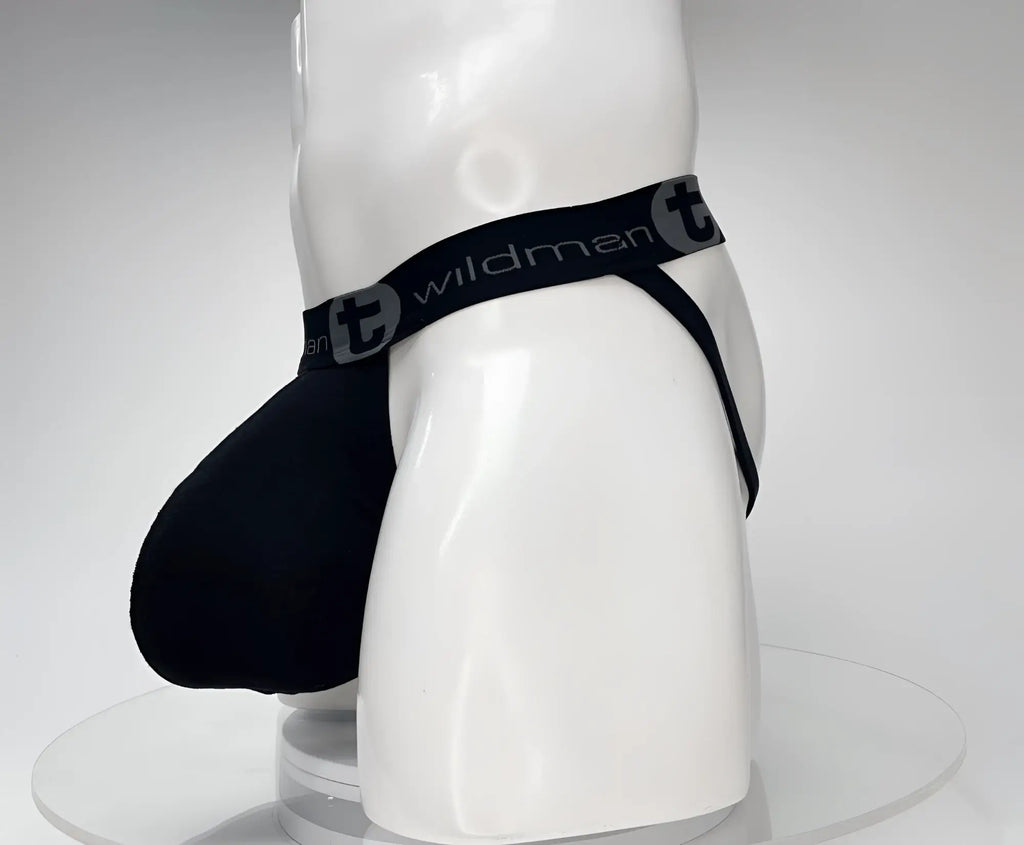 Black cotton jockstrap with a prominent pouch on a white mannequin, featuring a WildmanT logo waistband.