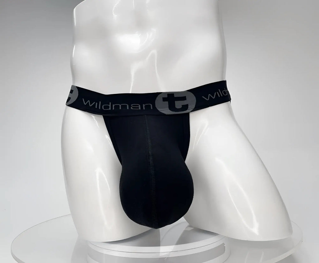 Black WildmanT jockstrap with a large, contoured pouch on a white mannequin torso.