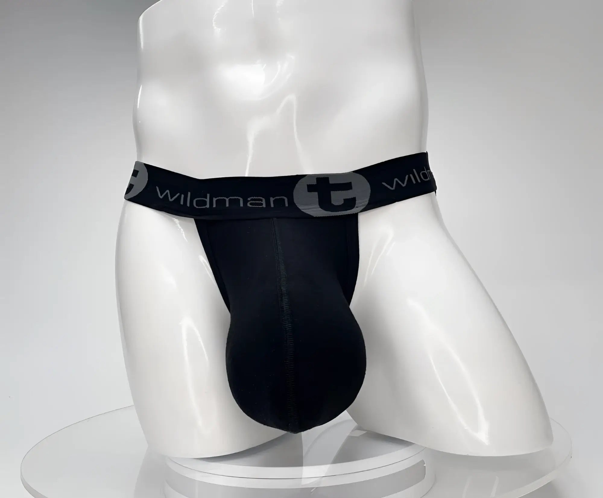 Black WildmanT jockstrap with a large, contoured pouch on a white mannequin torso.