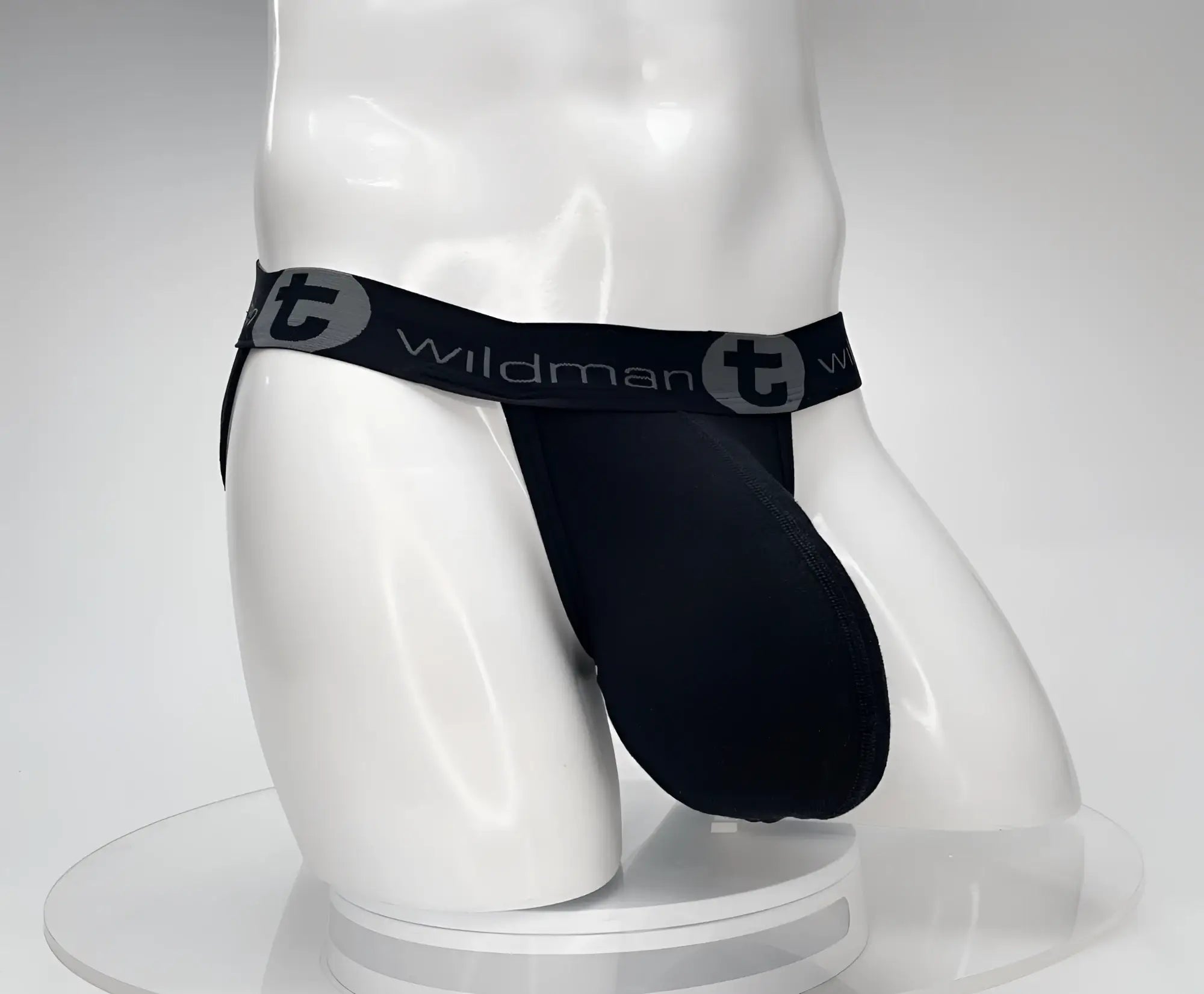 Black WildmanT cotton jockstrap featuring a prominent contoured pouch and elastic waistband with logo branding.