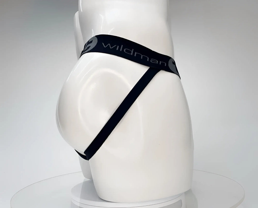 White mannequin wearing a black WildmanT jockstrap with branded elastic waistband on a white background.