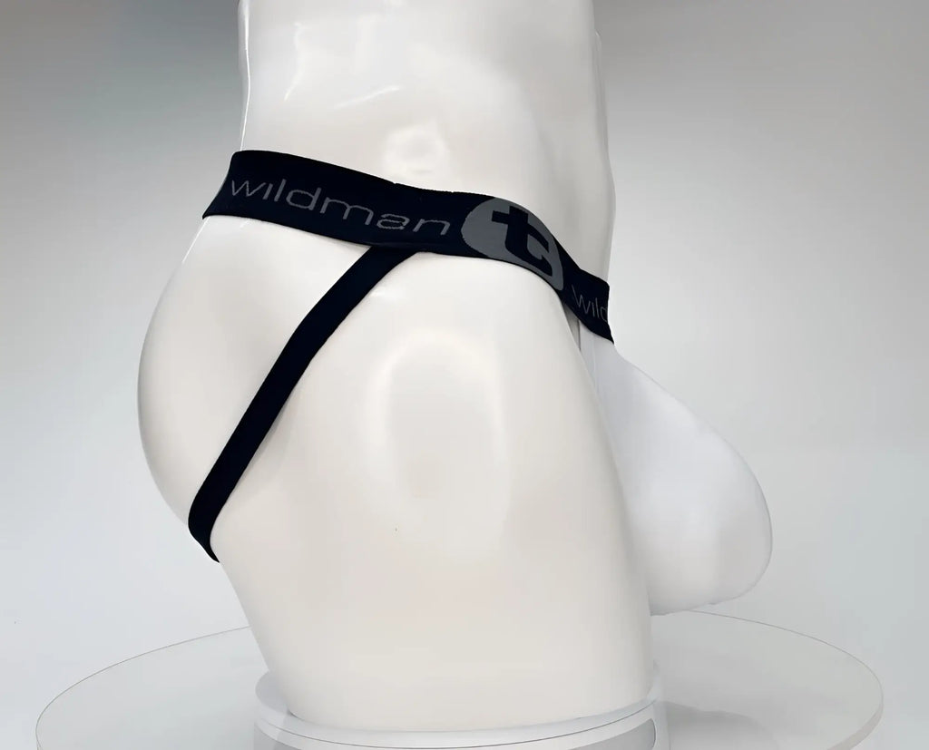 White WildmanT jockstrap with black branded elastic waistband and a contoured front pouch on a mannequin.