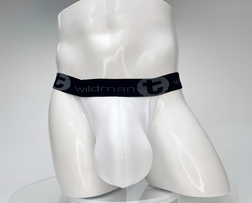 White cotton jockstrap with a large, contoured pouch and a black waistband featuring "WildmanT" branding.