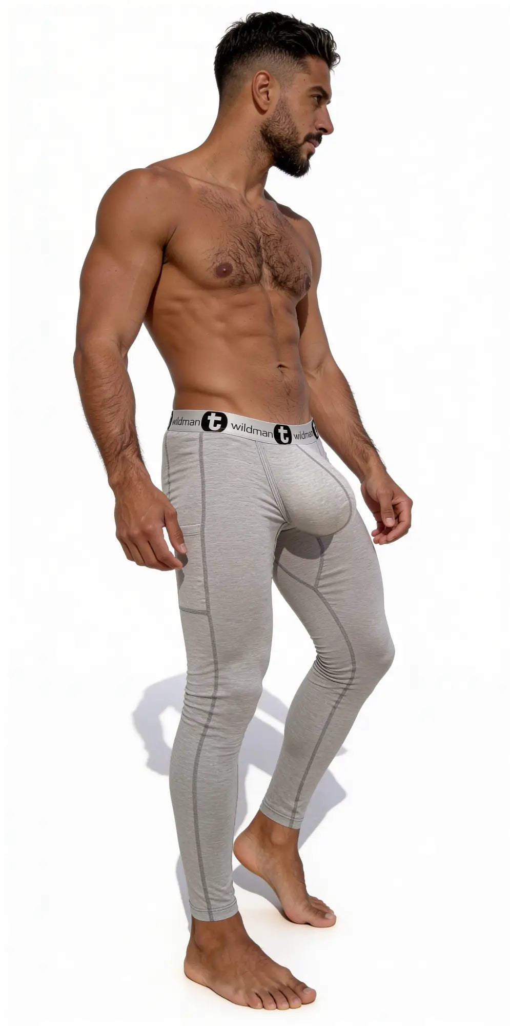 Man wearing grey cotton long johns with a prominent contoured pouch and a branded elastic waistband.