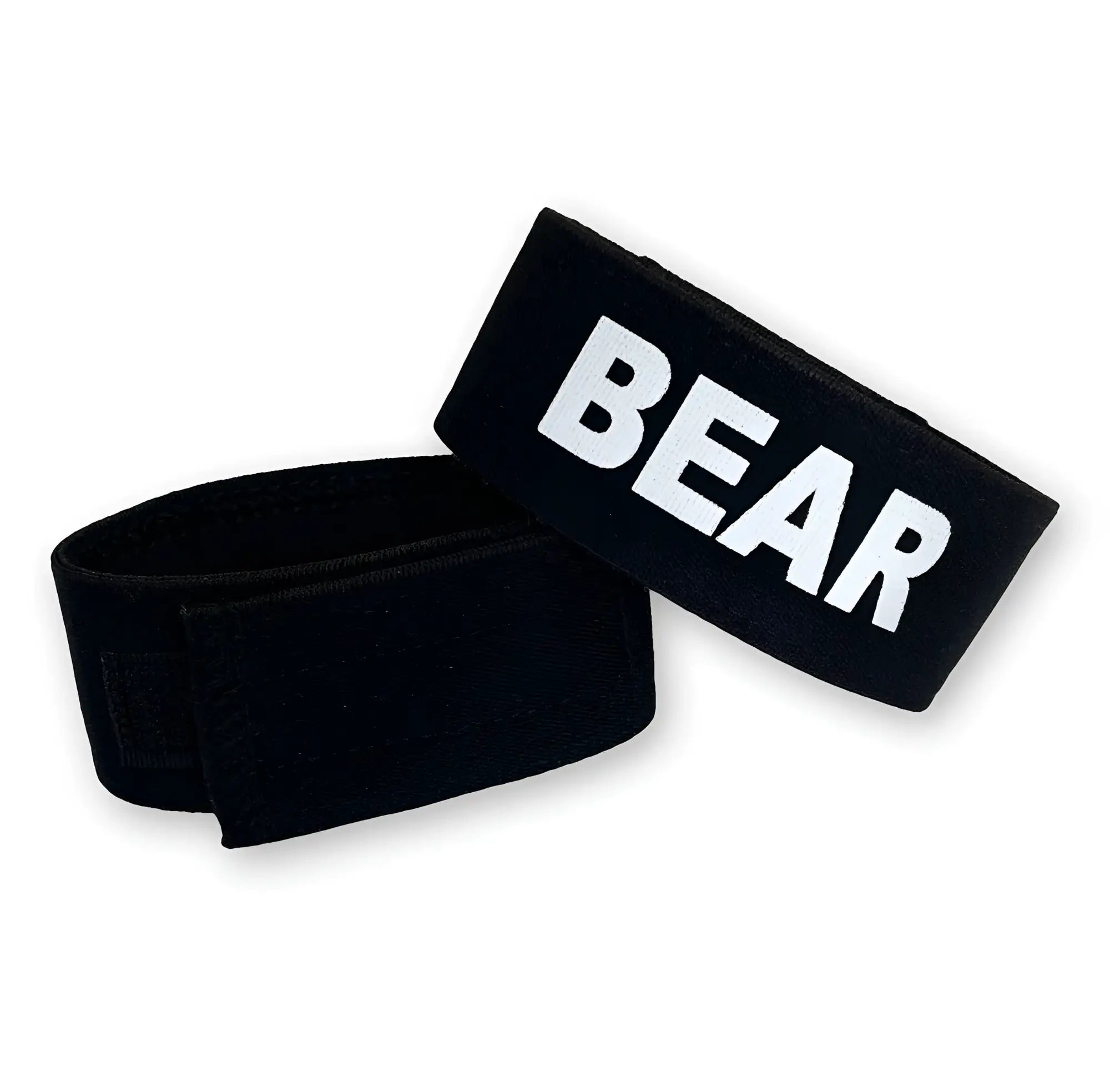 Two black, adjustable velcro cock-rings with the word "BEAR" printed in bold white letters on the fabric.