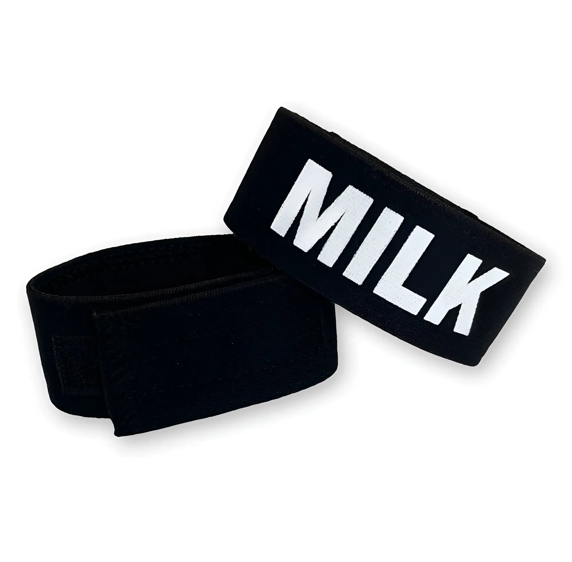 Two black adjustable elastic cock rings, one featuring the word "MILK" in bold white lettering against a white background.