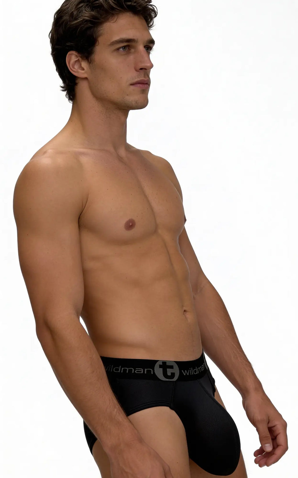 Model wears black WildmanT mesh briefs with a branded elastic waistband against a white background.