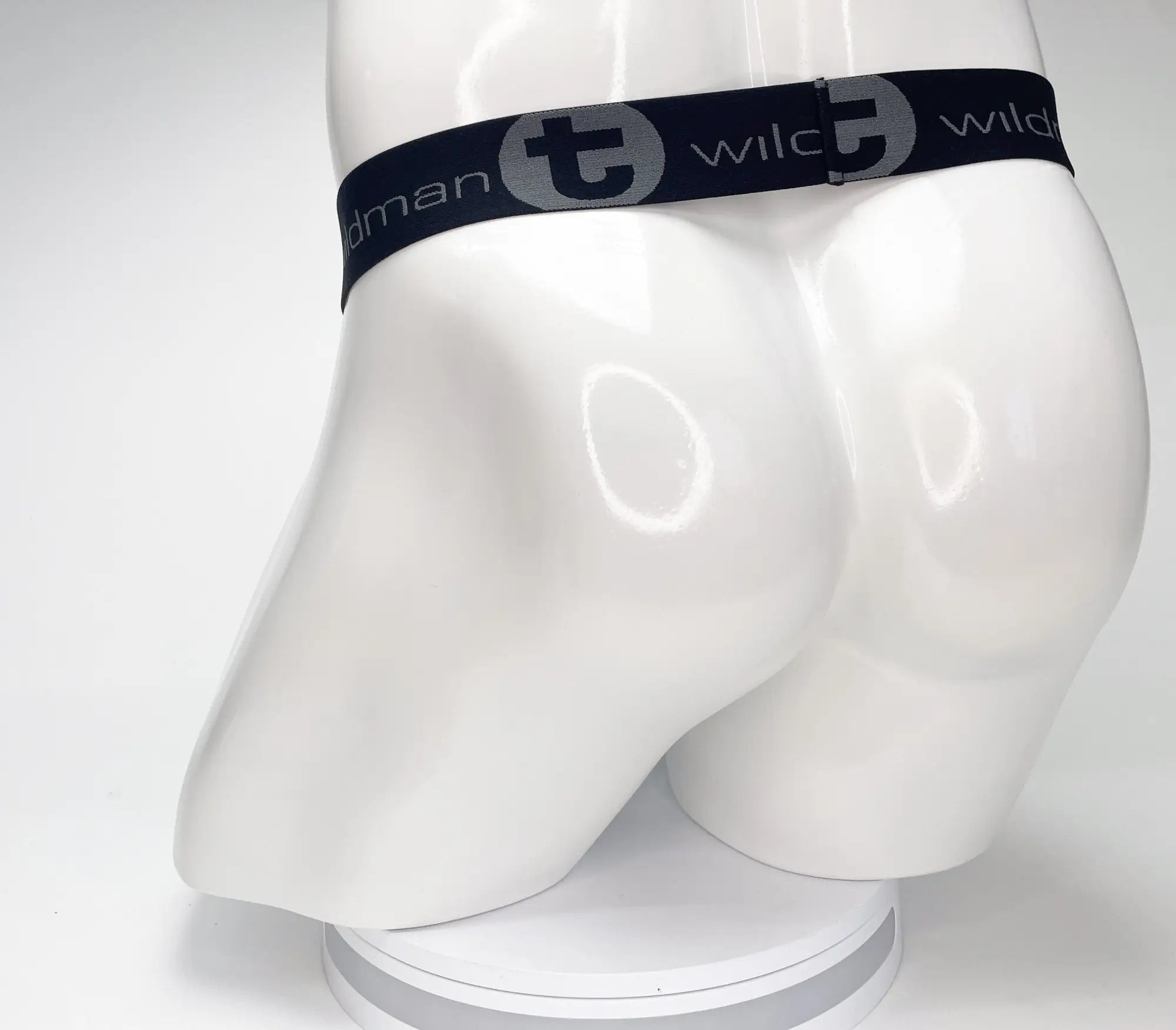 Black WildmanT strapless pouch featuring a wide elastic waistband with grey branded logo text on a white mannequin.