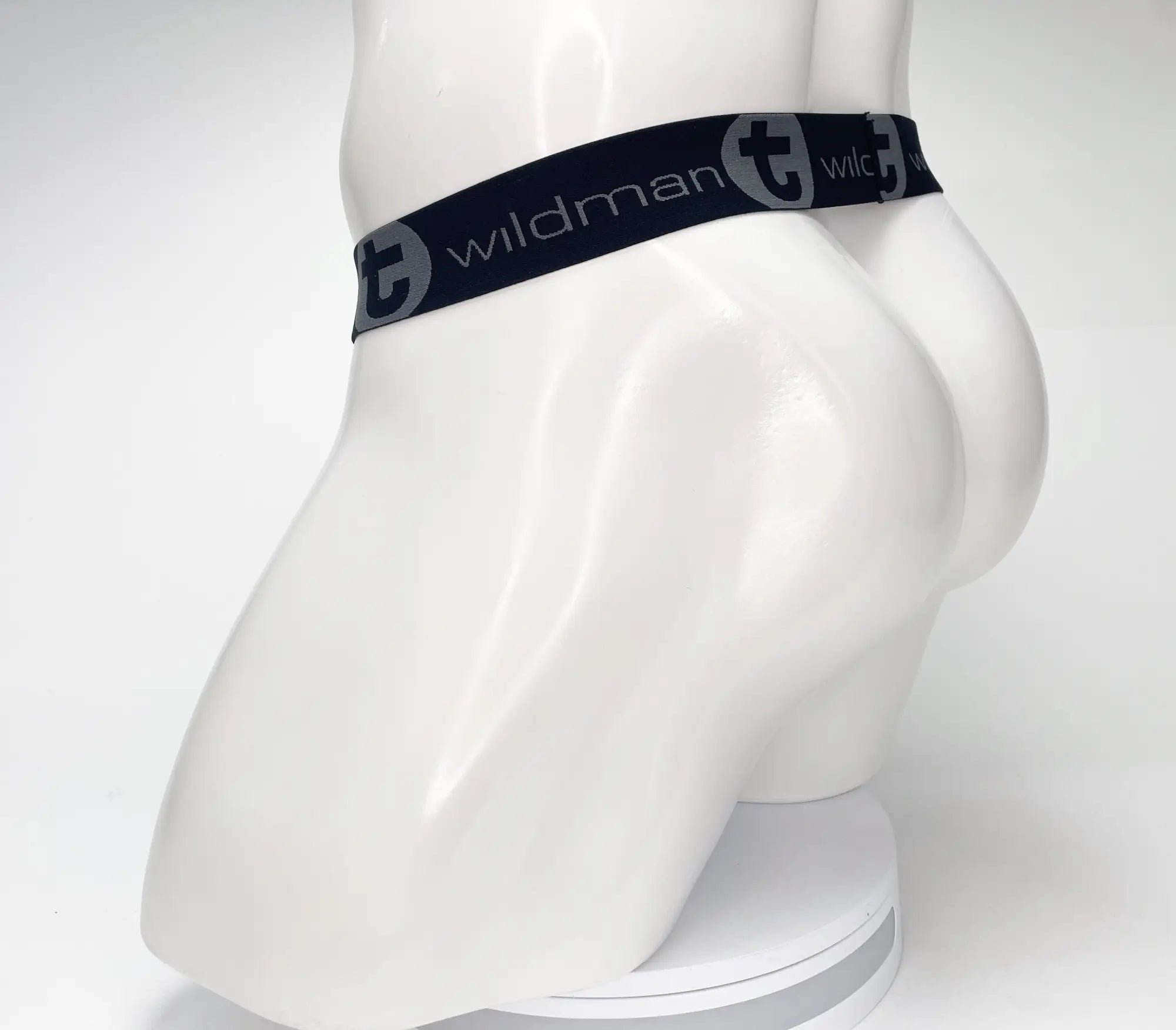 Black WildmanT strapless pouch with a branded elastic waistband on a white mannequin.
