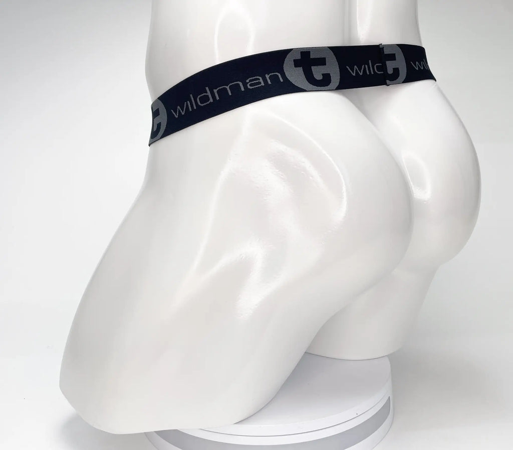 Black WildmanT strapless jockstrap featuring a branded elastic waistband on a white mannequin torso.