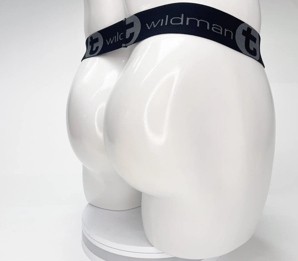 Black WildmanT strapless pouch waistband on a white mannequin torso. The waistband features grey "WildmanT" logo text.