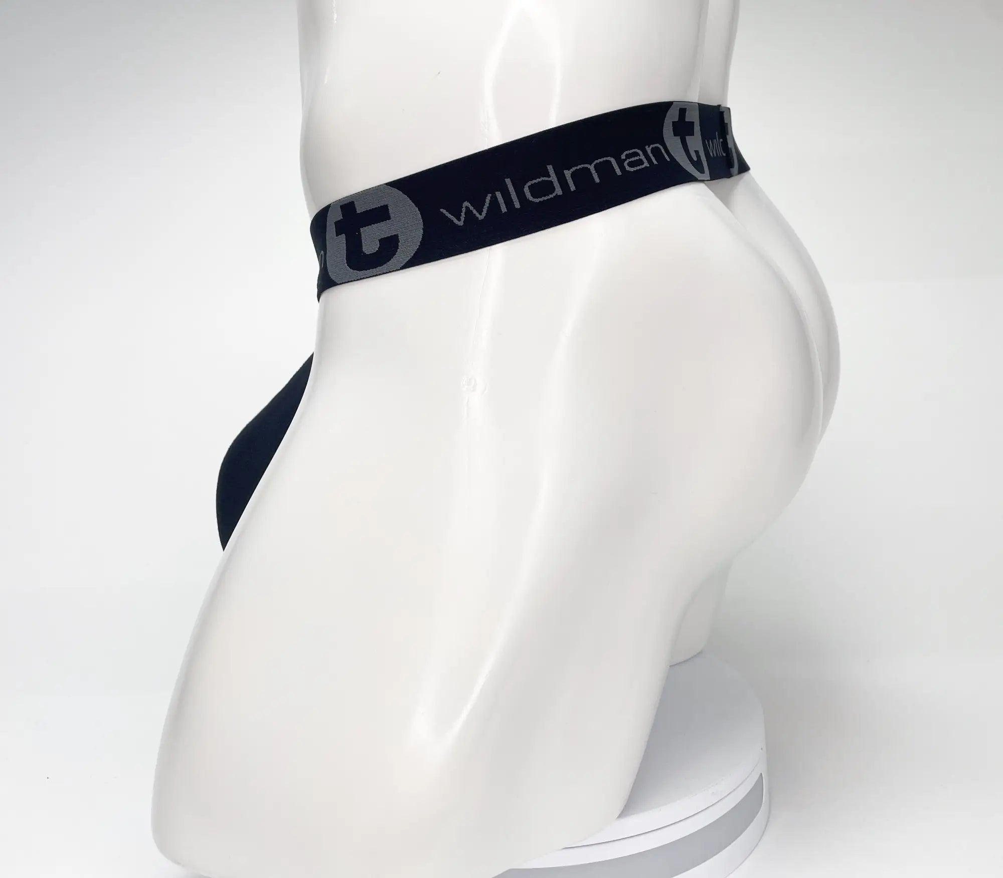 Black WildmanT strapless mesh pouch on a white mannequin, featuring a branded elastic waistband with the logo.