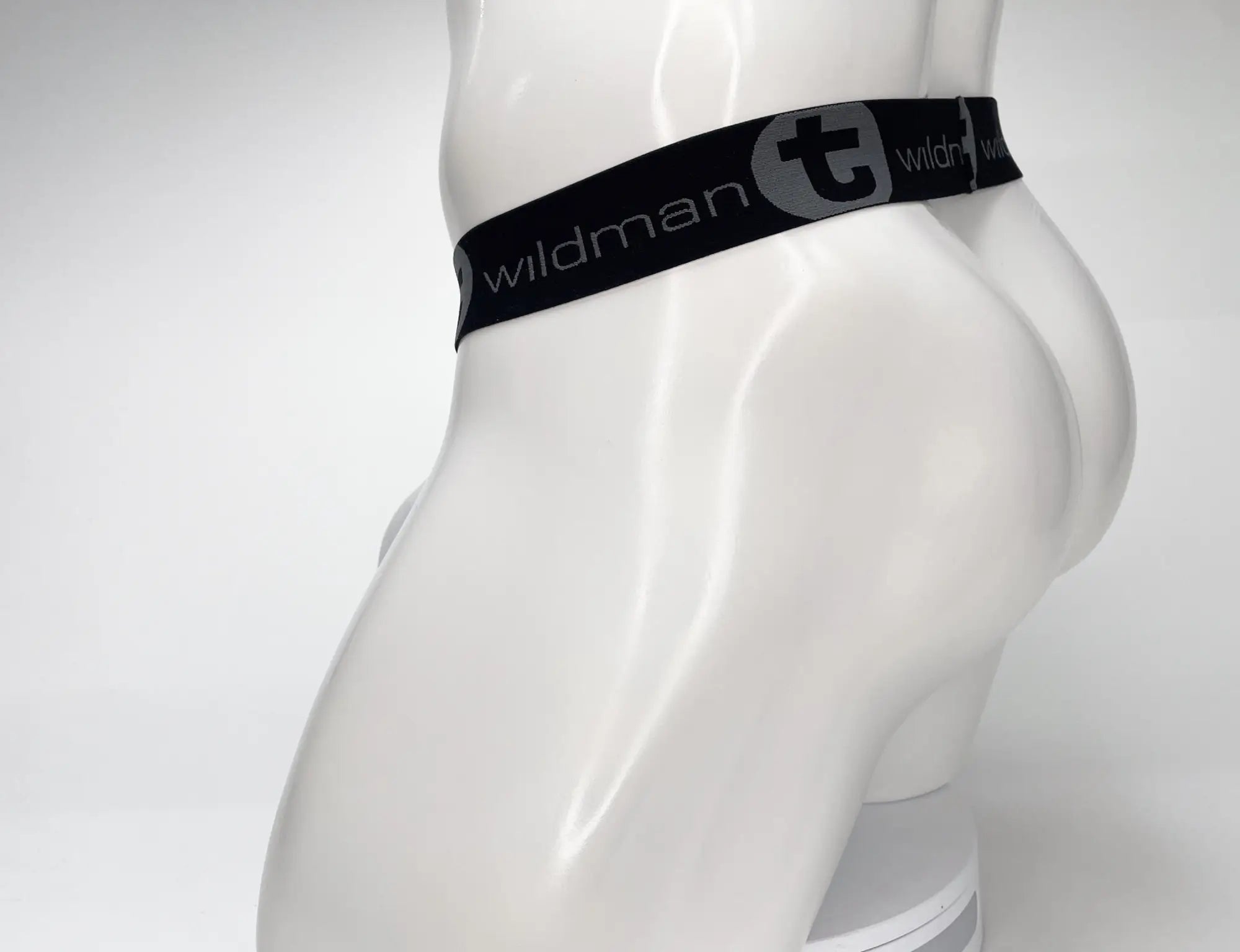 White WildmanT mesh strapless pouch on a mannequin, featuring a wide black waistband with grey branded logo.