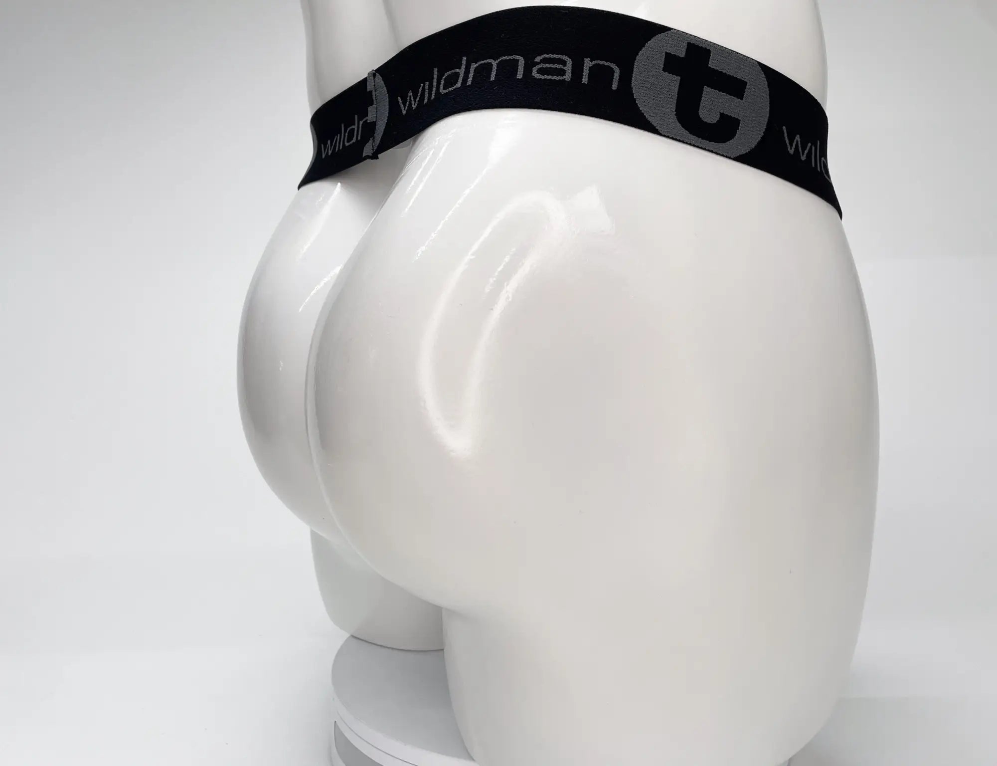 White mannequin wearing a black WildmanT branded waistband for a strapless pouch.