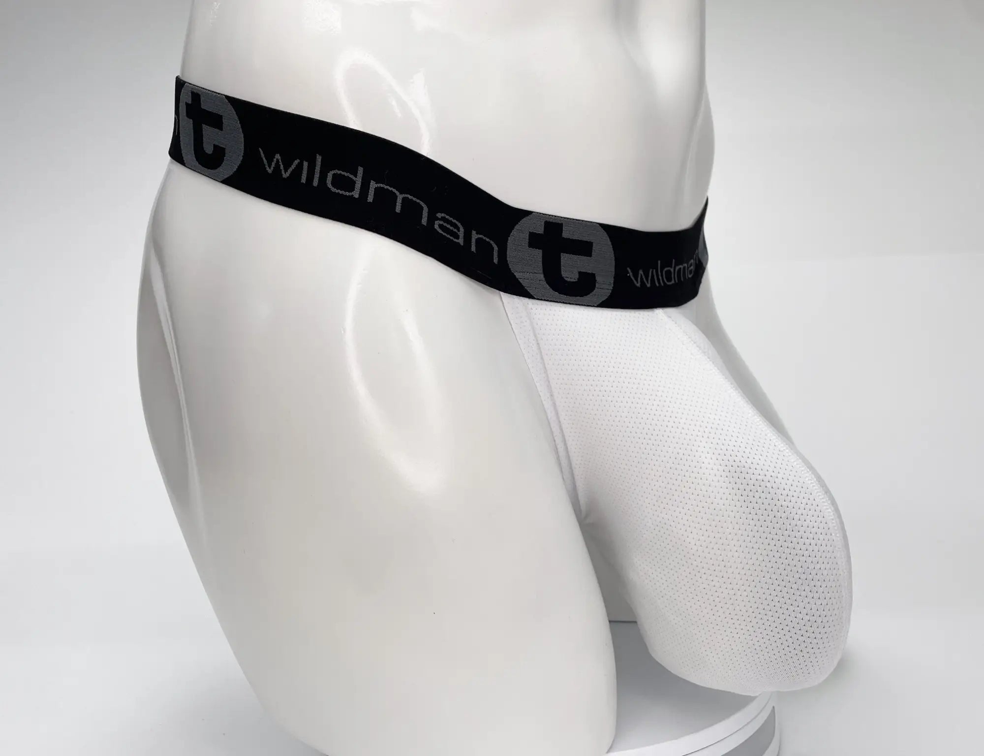 White mesh strapless pouch on a mannequin, featuring a black branded elastic waistband with grey "WildmanT" logo text.