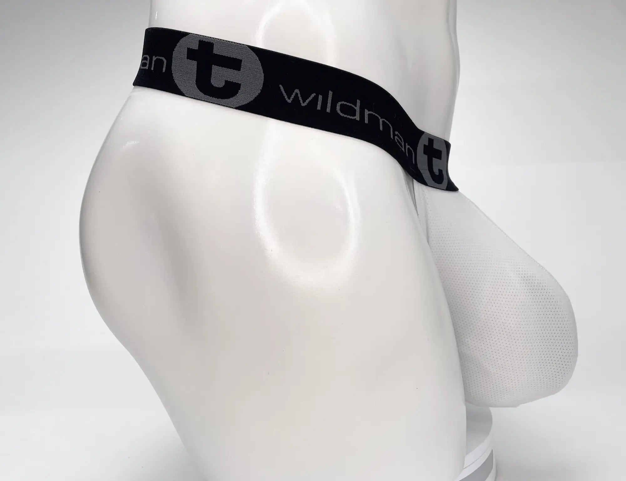 White mesh strapless pouch on a mannequin with a black WildmanT branded elastic waistband.