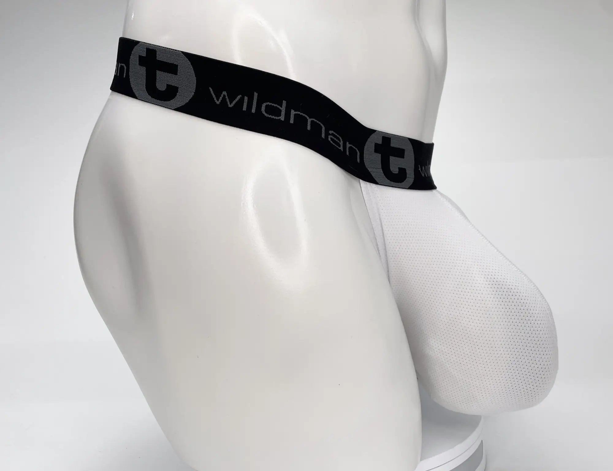 White WildmanT mesh strapless pouch on a mannequin, featuring a wide black branded waistband with "T" logo.