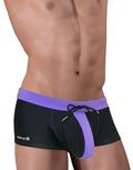 Black and purple square-cut swim trunks with a front pouch, drawstring, and Wildman logo on the hip.