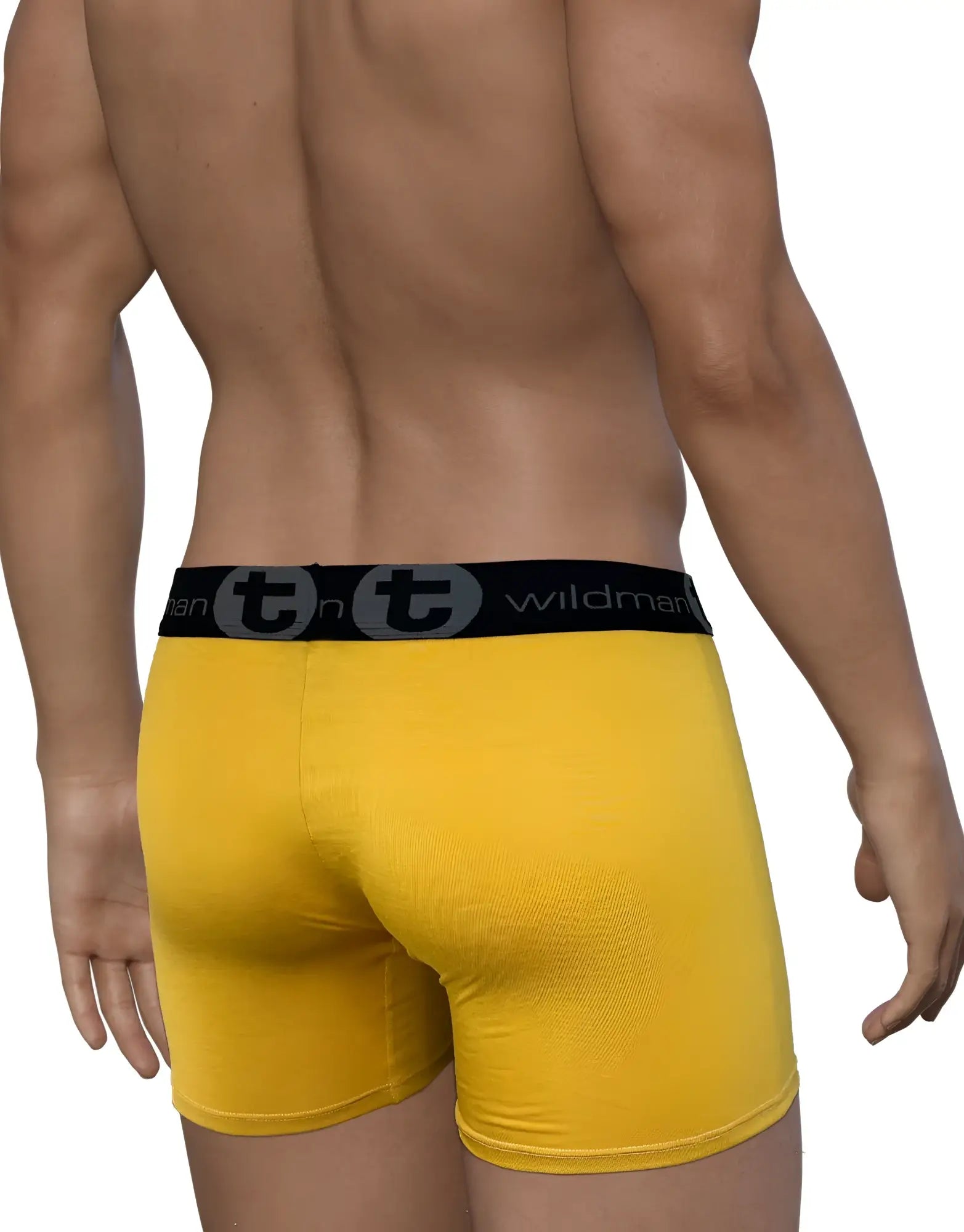 Back view of a man wearing gold WildmanT boxer briefs with a black branded waistband on a white background.