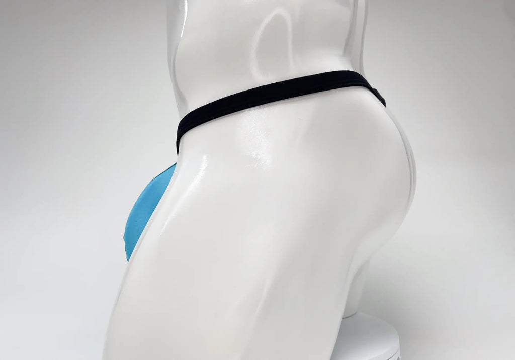 Baby blue modal micro thong with a black waistband on a white mannequin, side view.