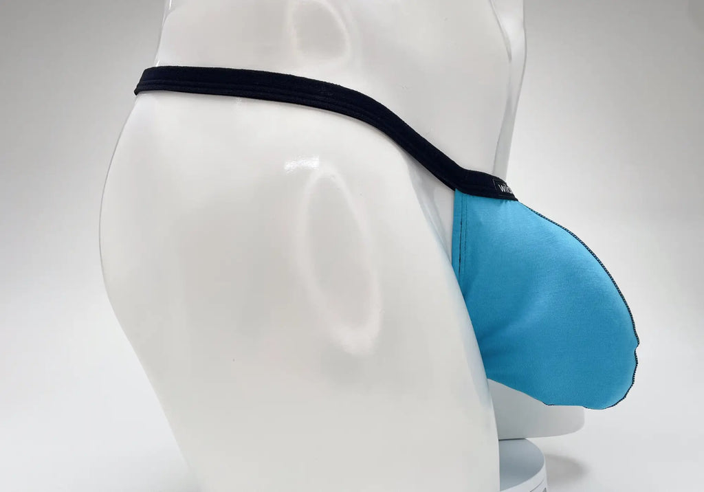 Baby blue modal micro thong with a prominent pouch and thin black waistband, shown on a white mannequin.