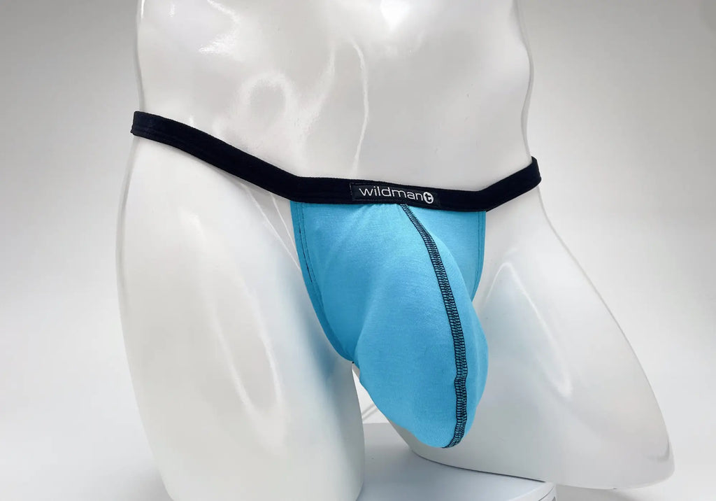 Baby blue WildmanT Modal micro thong with a large pouch, black waistband, and contrast black stitching.