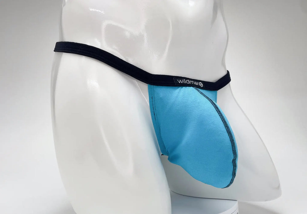 Baby blue modal micro thong with a prominent "Big Boy" pouch and black waistband featuring a WildmanT logo tag.