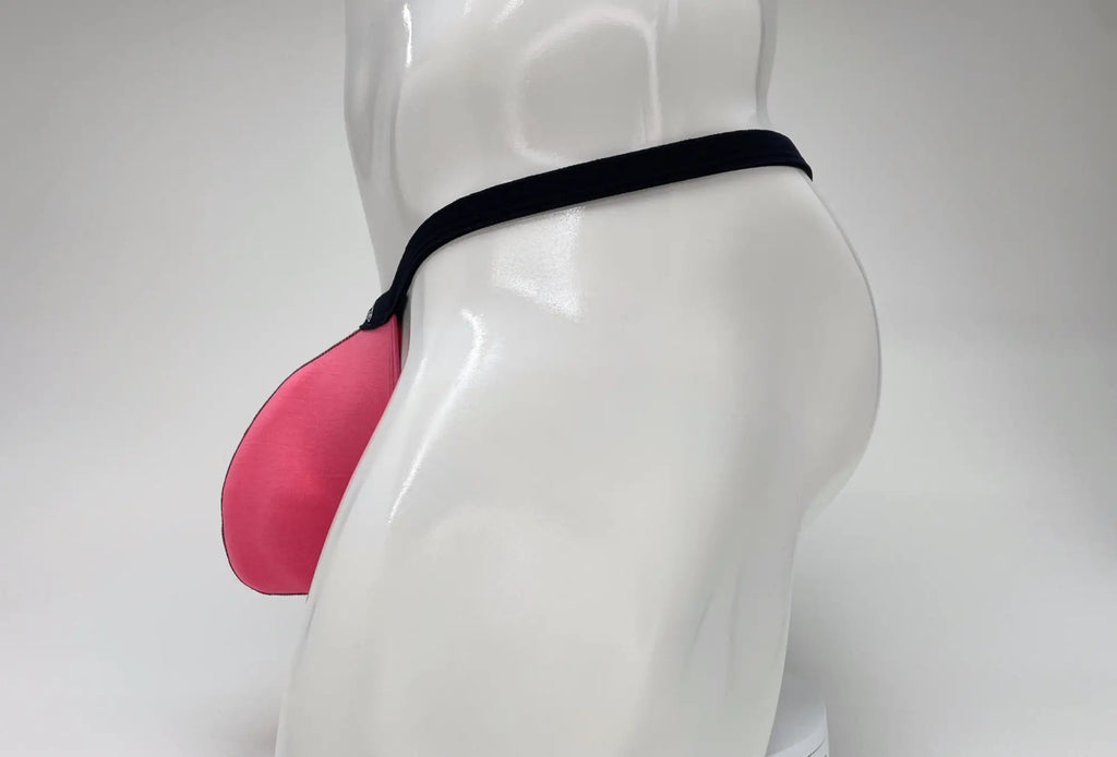 Side view of a bright pink modal micro thong with a large pouch and thin black waistband on a white mannequin.