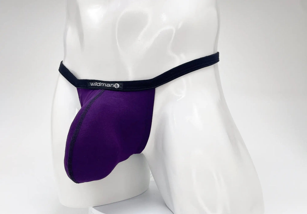 Purple modal micro thong with a large pouch and black waistband featuring the white WildmanT logo on a male mannequin.