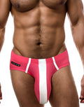WildmanT modal brief in pink with a prominent white vertical stripe and a branded logo tag on the side.