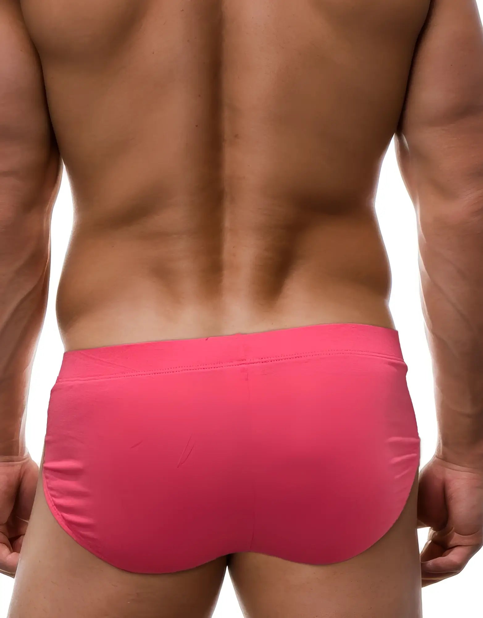 Back view of a muscular man wearing pink WildmanT modal briefs with a clean, fitted design.