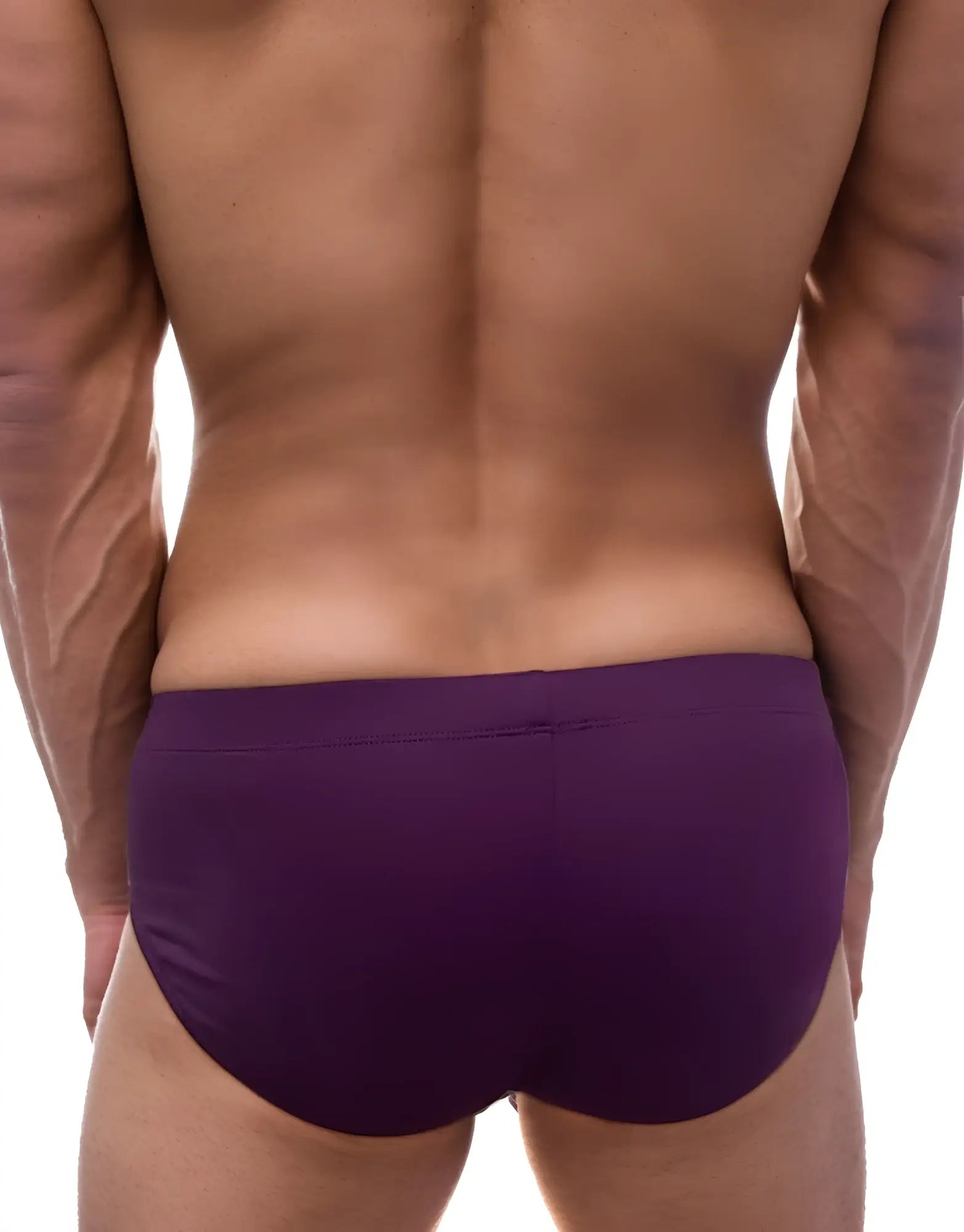 Back view of a man wearing solid purple modal briefs with a smooth, fitted cut.