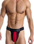 WildmanT red and black jockstrap featuring a breathable mesh pouch with a central stripe and branded elastic waistband.