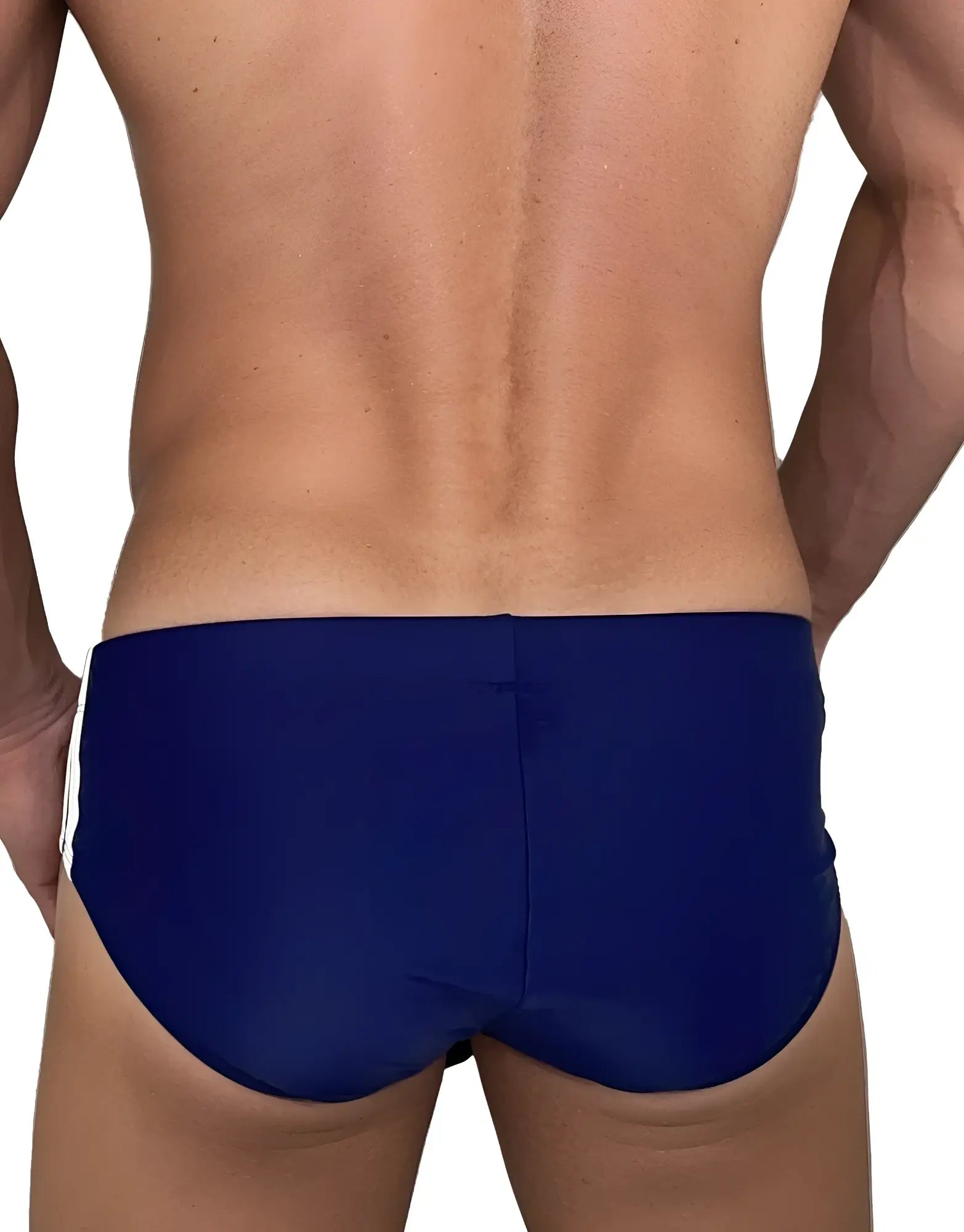 Rear view of a man wearing navy blue WildmanT swim briefs with white side stripes.
