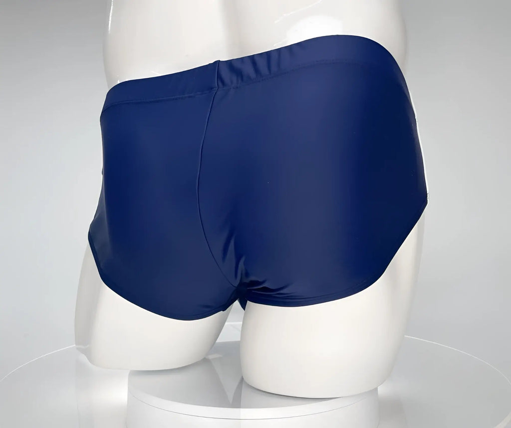 Back view of WildmanT Monster Cock navy swim brief on a white mannequin.