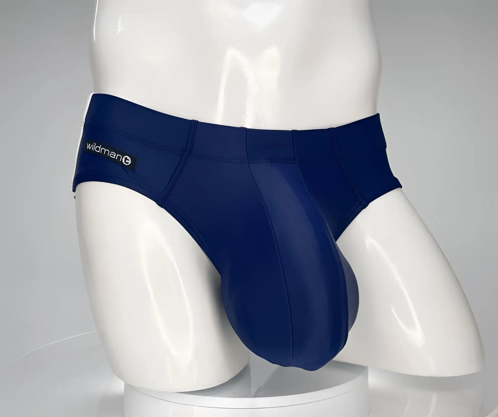 Navy WildmanT swim brief with a contoured pouch on a white mannequin torso.