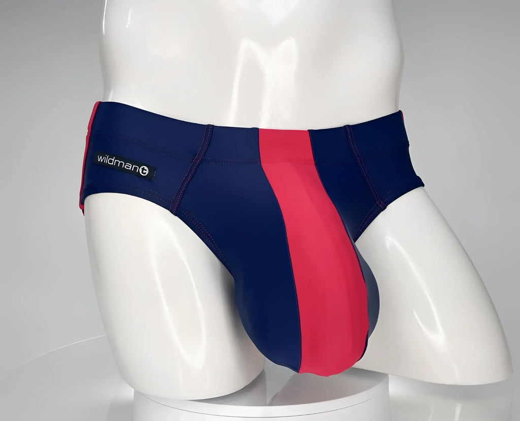 WildmanT navy and red swim brief with a large pouch and contrast stitching on a white mannequin.