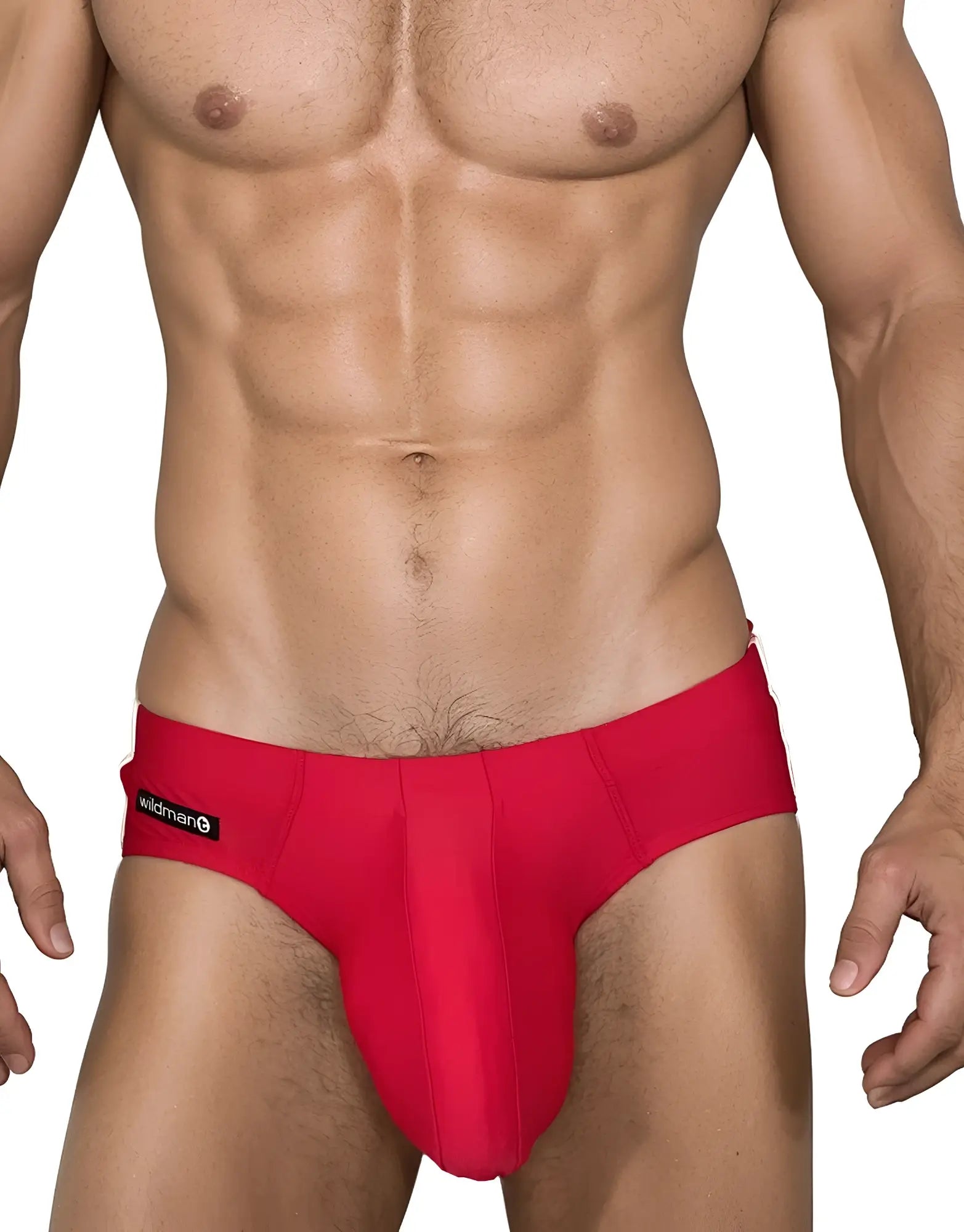 Red WildmanT swim brief with a contoured pouch and black logo tag on the hip, worn by a muscular man.