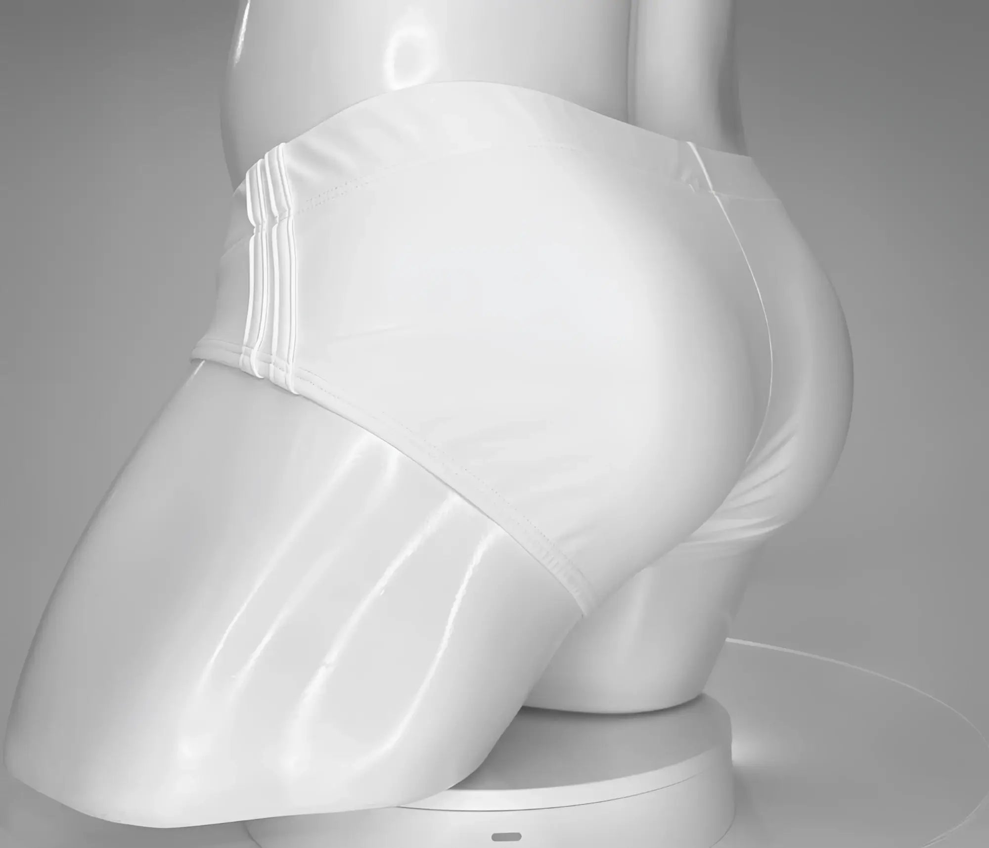 Back view of a white, low-rise swim brief with side-seam detailing on a white mannequin torso.