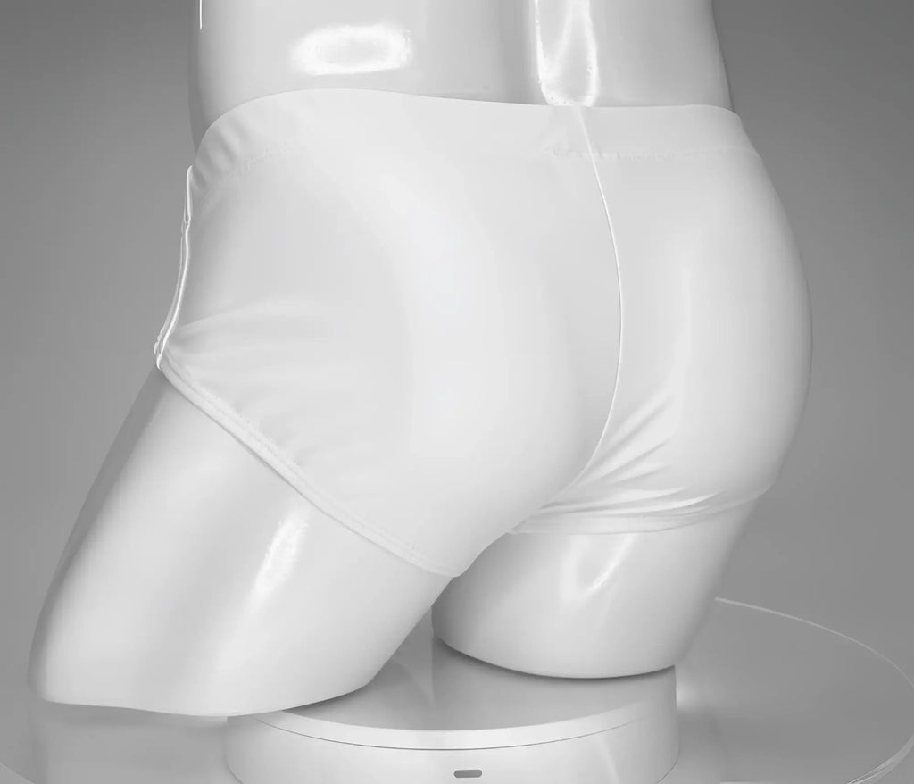 Back view of WildmanT white swim briefs on a male mannequin torso against a gray background.