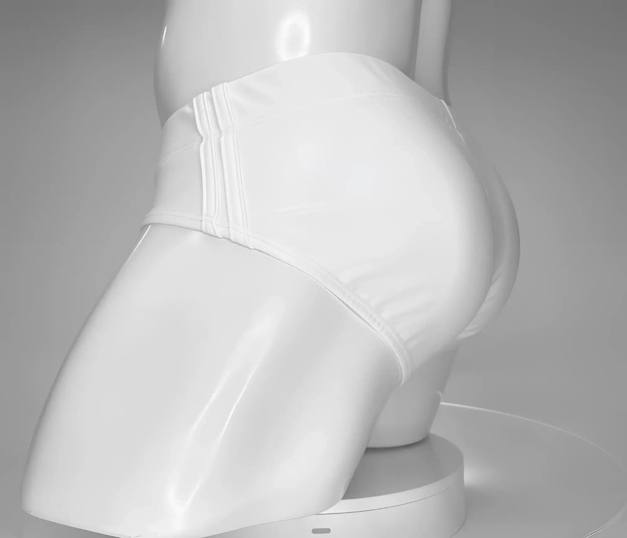 White swim brief worn by a mannequin, featuring a side-panel design with triple-stitched vertical details.