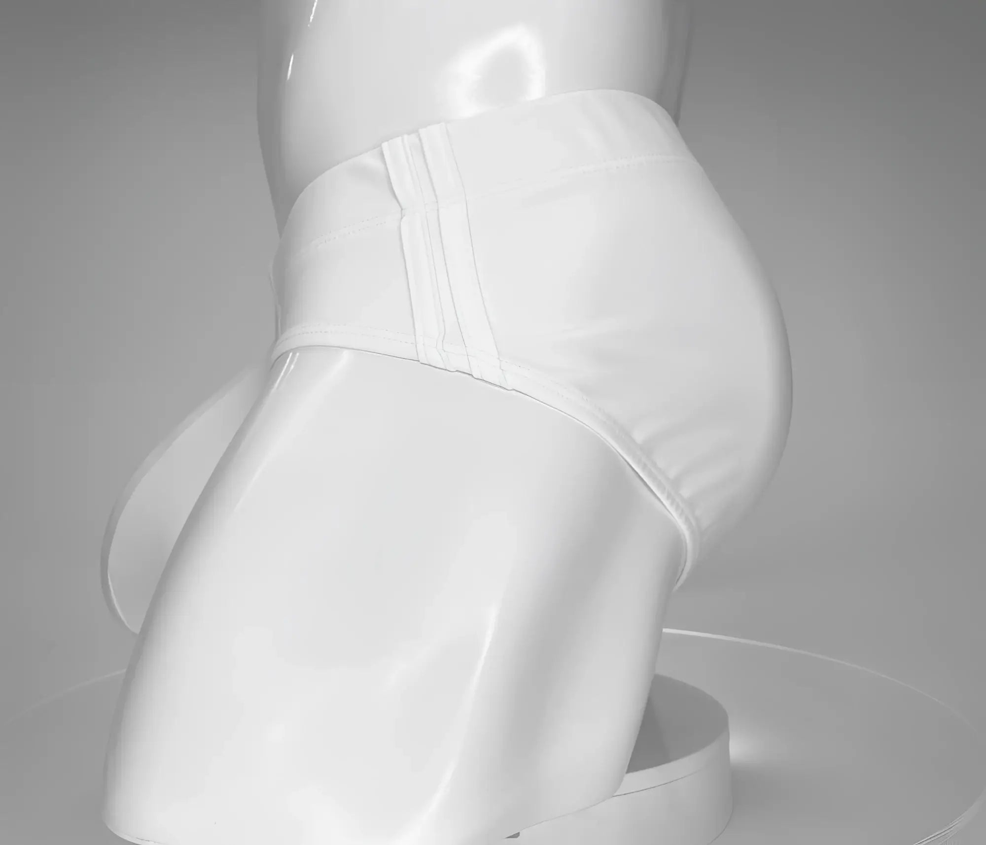 White WildmanT swim brief on a mannequin torso, featuring side panel stitching and a contour fit.