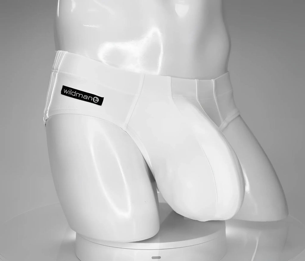 White WildmanT swim brief on a white mannequin featuring a large, contoured pouch and black brand logo on the side.