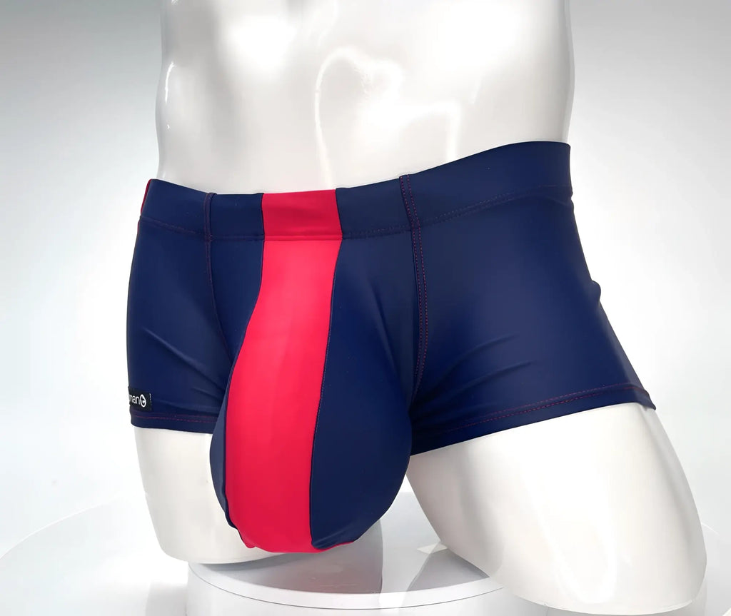 Navy blue square-cut swim trunks with a prominent red vertical center stripe and red contrast stitching.