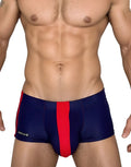 WildmanT navy square-cut swim trunks with a bold red center stripe and side accents, featuring a small brand logo tag.