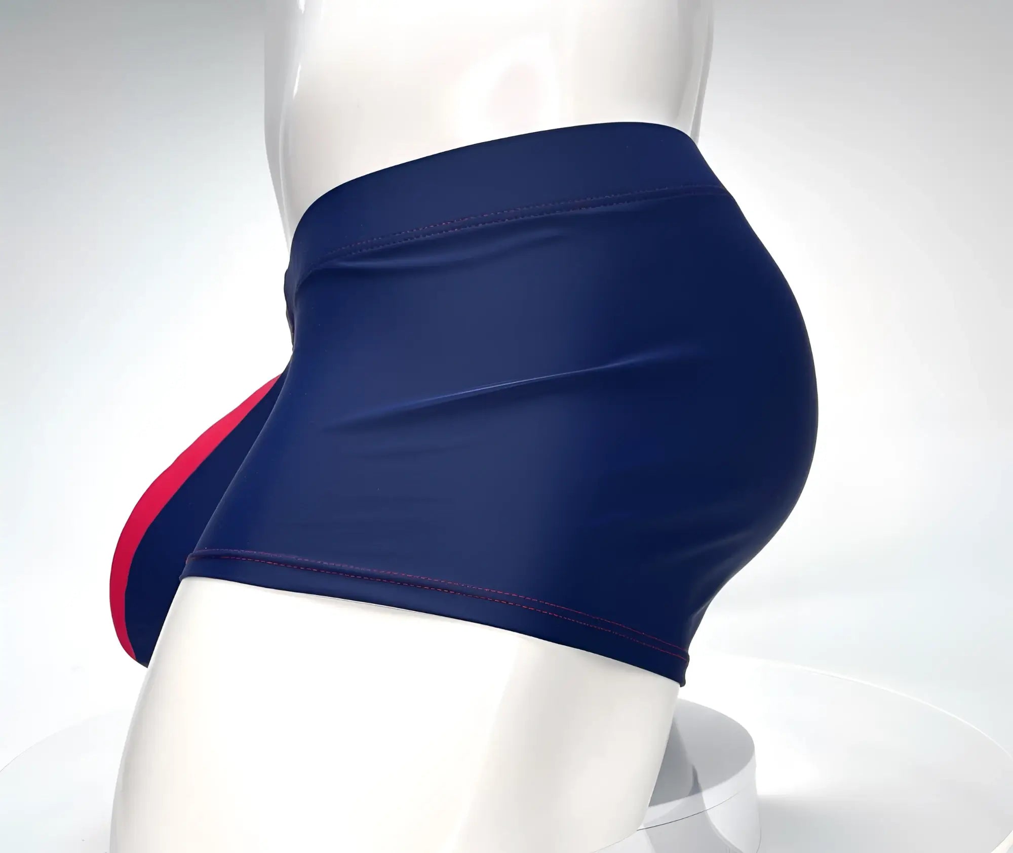 Navy blue square-cut swim trunks with red trim detail, shown on a white mannequin torso.