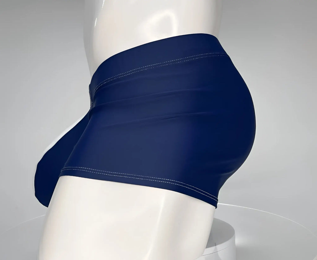 Side view of navy and white square-cut swim trunks on a white mannequin, featuring contrast stitching.