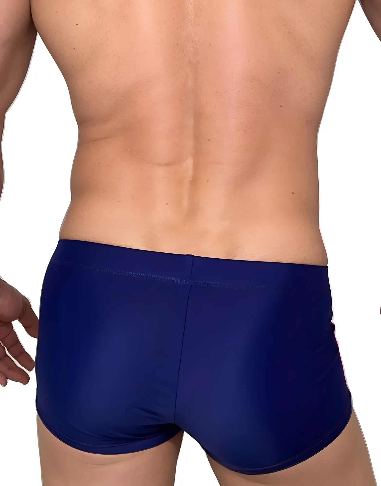 Back view of a man wearing navy blue square-cut swim trunks.